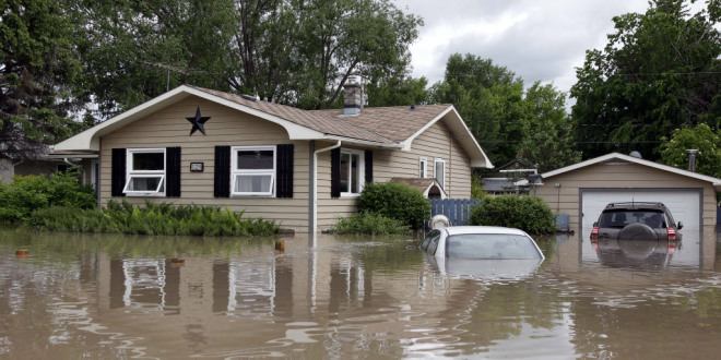 A flooded residence in High river, Alta. Heavy rains have caused flooding, closed roads, and forced evacuation in High River, Alta., Thursday, June 20, 2013.THE CANADIAN PRESS/Jeff McIntosh